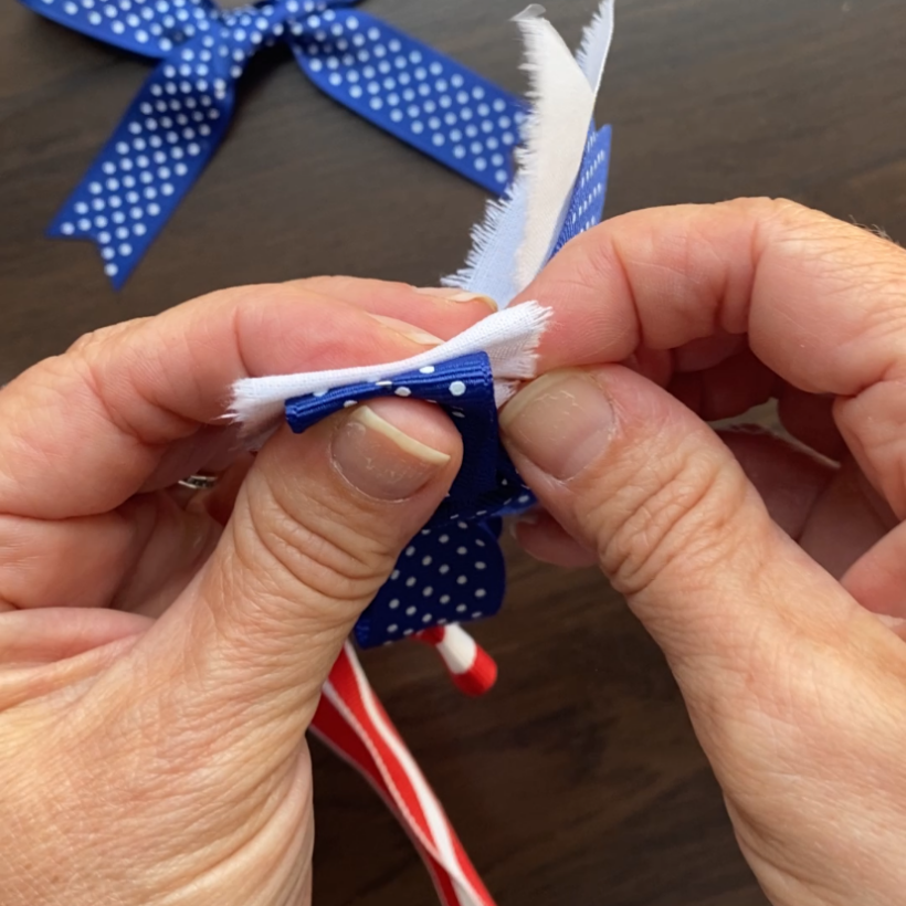 Sew bow loops together with a needle and thread