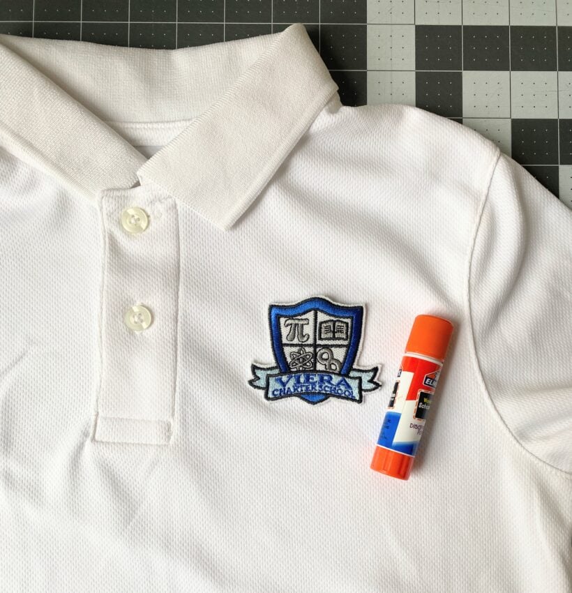 Baste the uniform patch to the shirt with a glue stick.