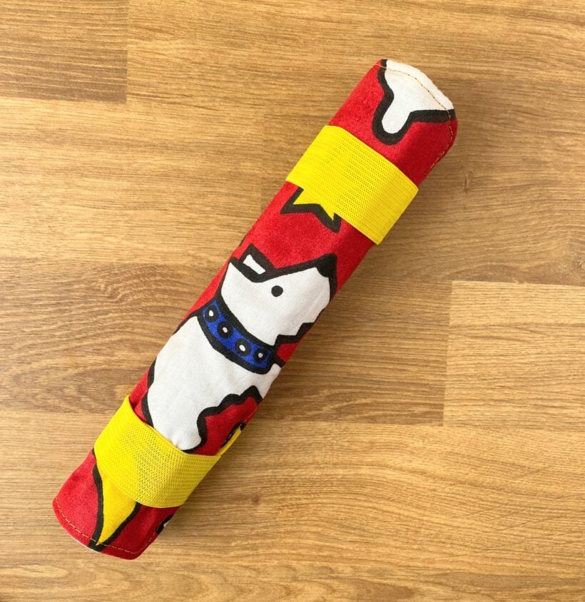 colored pencil roll held with elastic