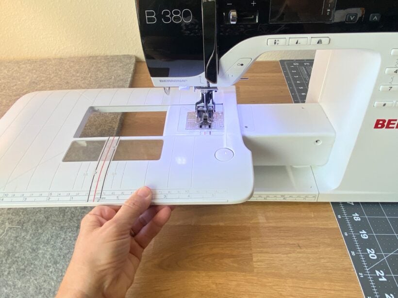 slide the sewing table off the machine Bernina B380